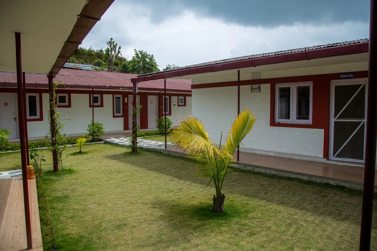Guest-room buildings around a green resort courtyard